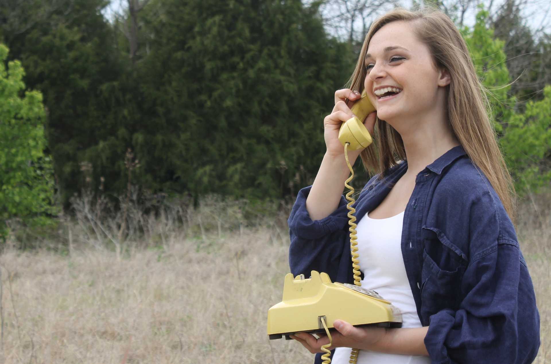 woman on phone connected to broadband